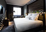 חדרי האירוח של מלון NYX מדריד מעוצבים בנוחות פונקציונלית ומצוידים בכל האבזור הדרוש לחופשה מפנקת